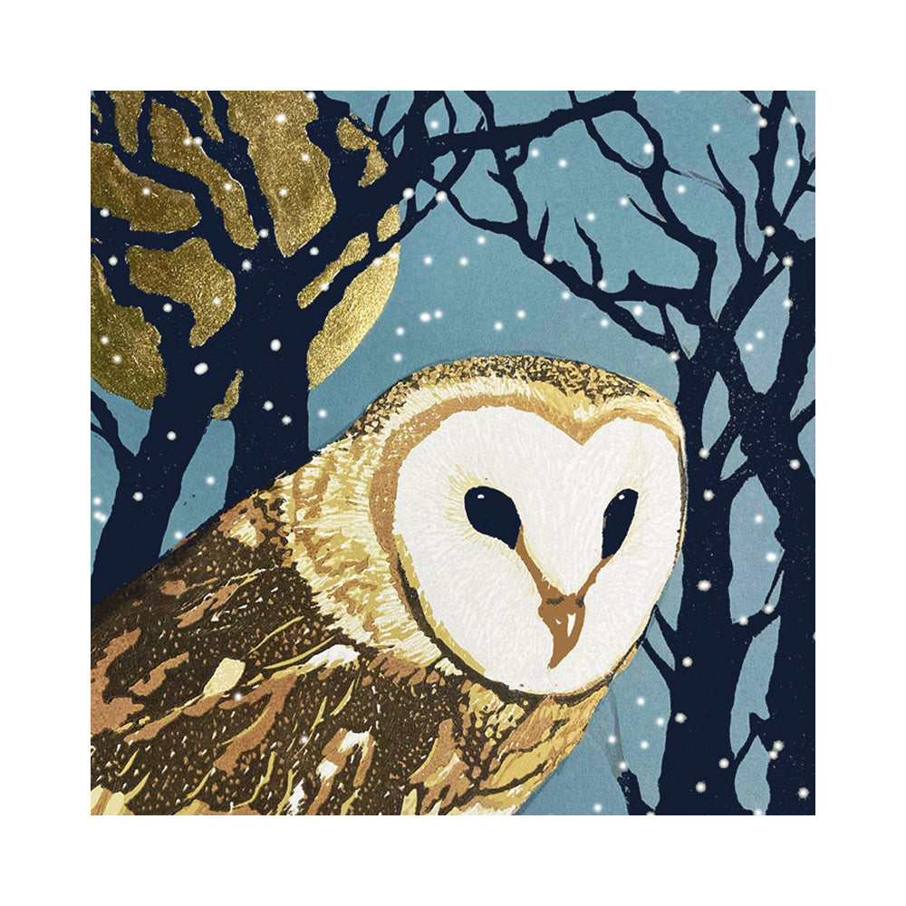 A linocut of a Barn Owl perched in a bare tree on a snowy wintry night with a large gold shining moon which highlights the golden streaks of the owl's plumage in the moonlight, with a background of bare trees shadowed against the moon.
