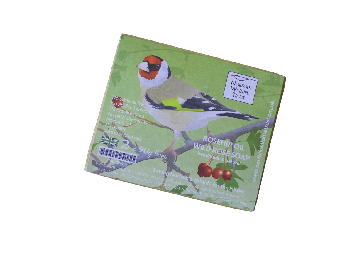 A brown Kraft gift box of two bars of soap decorated with an image of a goldfinch and the Norfolk Wildlife Trust logo